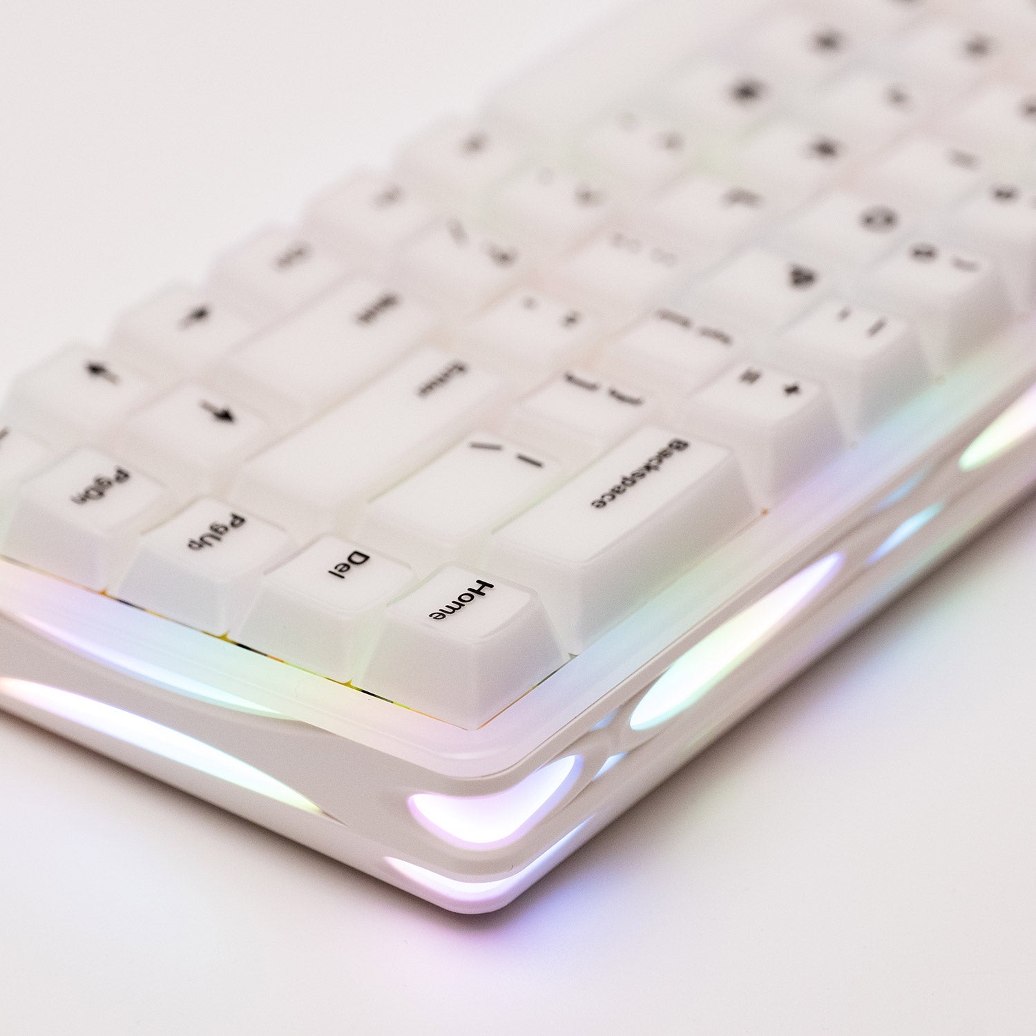 Close-up of a Verve68 HE keyboard with RGB lighting on a light background