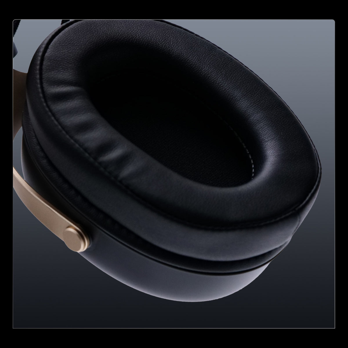 Akko Verge S9 Master close-up view of the skin-friendly full-cover black leather headphone earpad with gold metallic accent