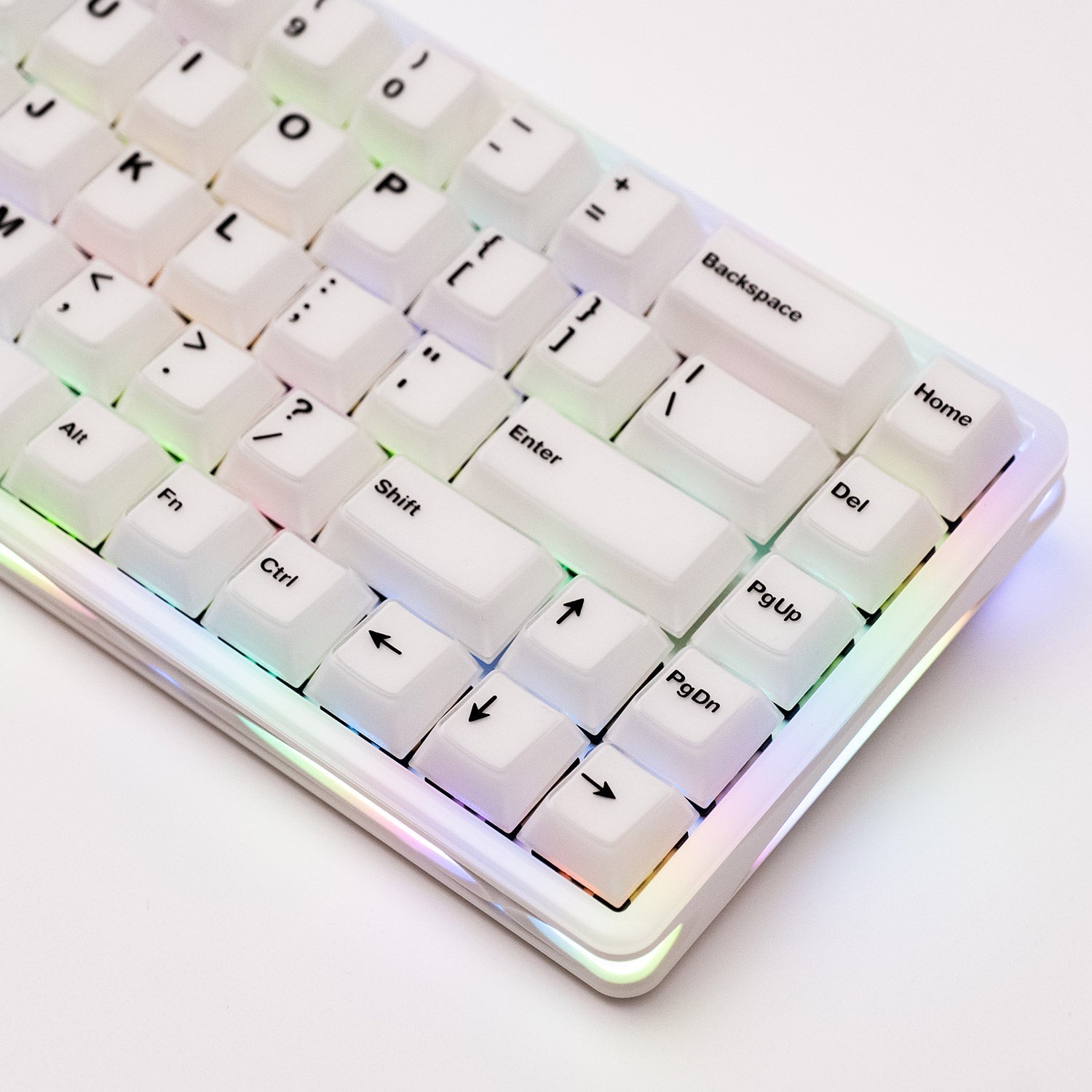 Close-up of a Verve68 HE keyboard with RGB backlighting on a light background