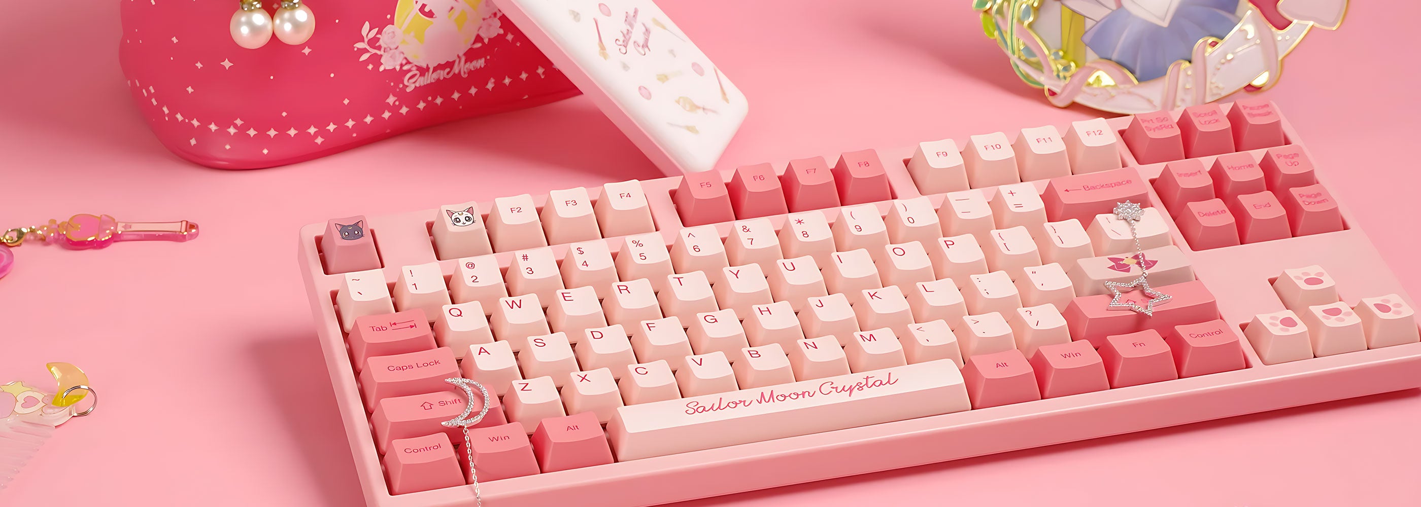 Akko Sailor Moon Crystal 3087 Keyboard surrounded by various Sailor Moon-themed accessories on a clean surface